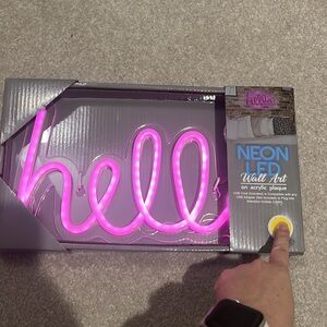 Neon pink “hello” sign
